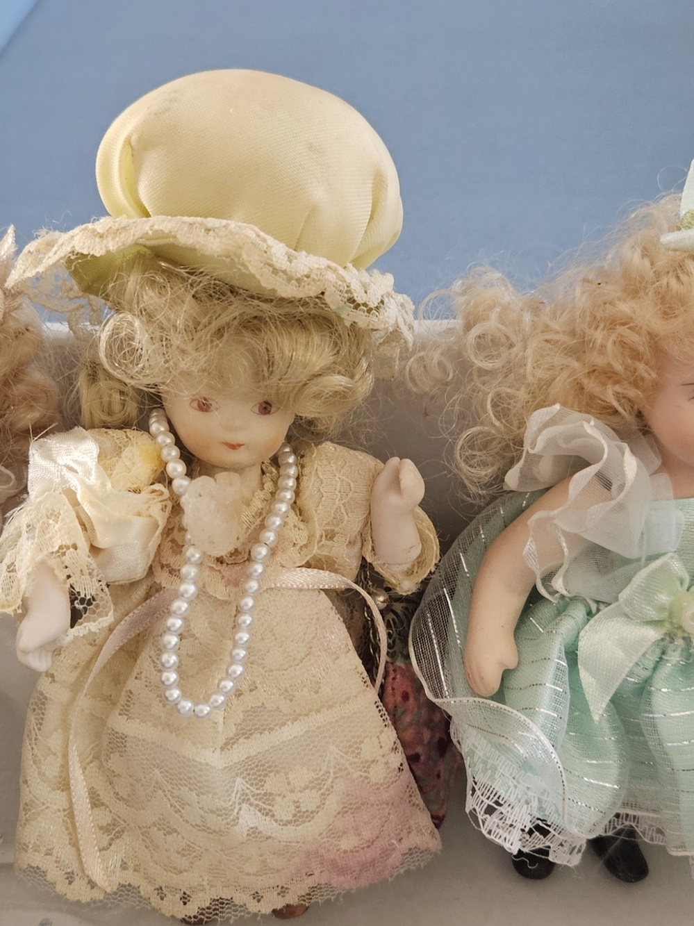 Three Adorable Mini Porcelain Dolls in Dresses